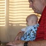 JD helping grandpa send an email.