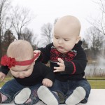 Thank goodness she was wearing a headband and that JD is so strong! Don't worry, no babies were harmed in this photo, JIm was holding them from behind!