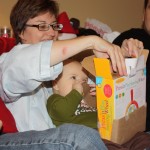 Grandma helped JD open his toy. He enjoyed the box at first, then the lights and sounds were intriguing! 